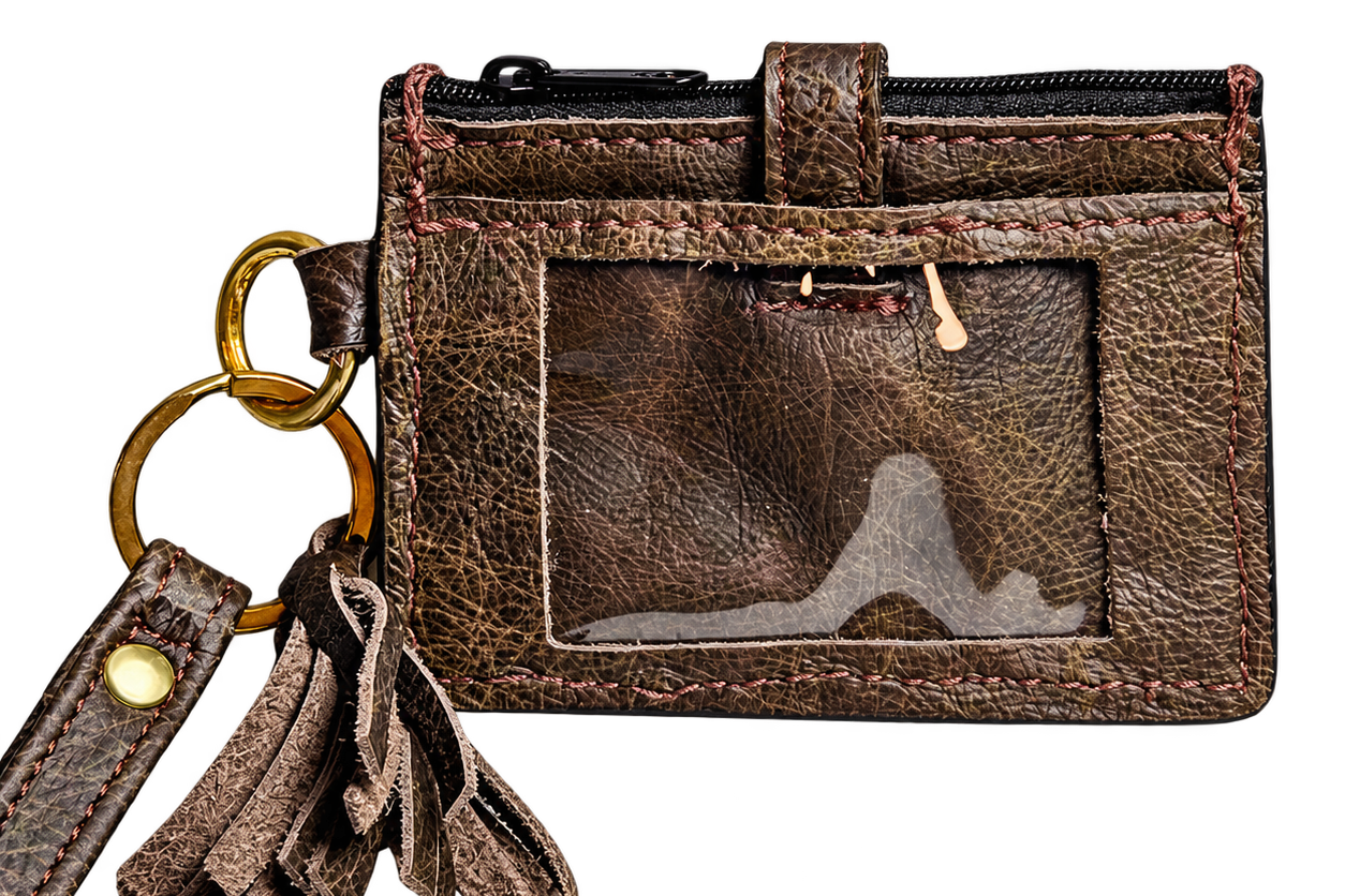Back of dark brown leather wristlet wallet showing clear ID window, zipper and matching tassel.