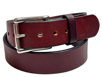 Premium heavy brown leather gun belt coiled with stainless steel roller buckle and matching leather keeper.