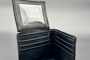 Black water buffalo leather card slots inside an alligator bifold wallet