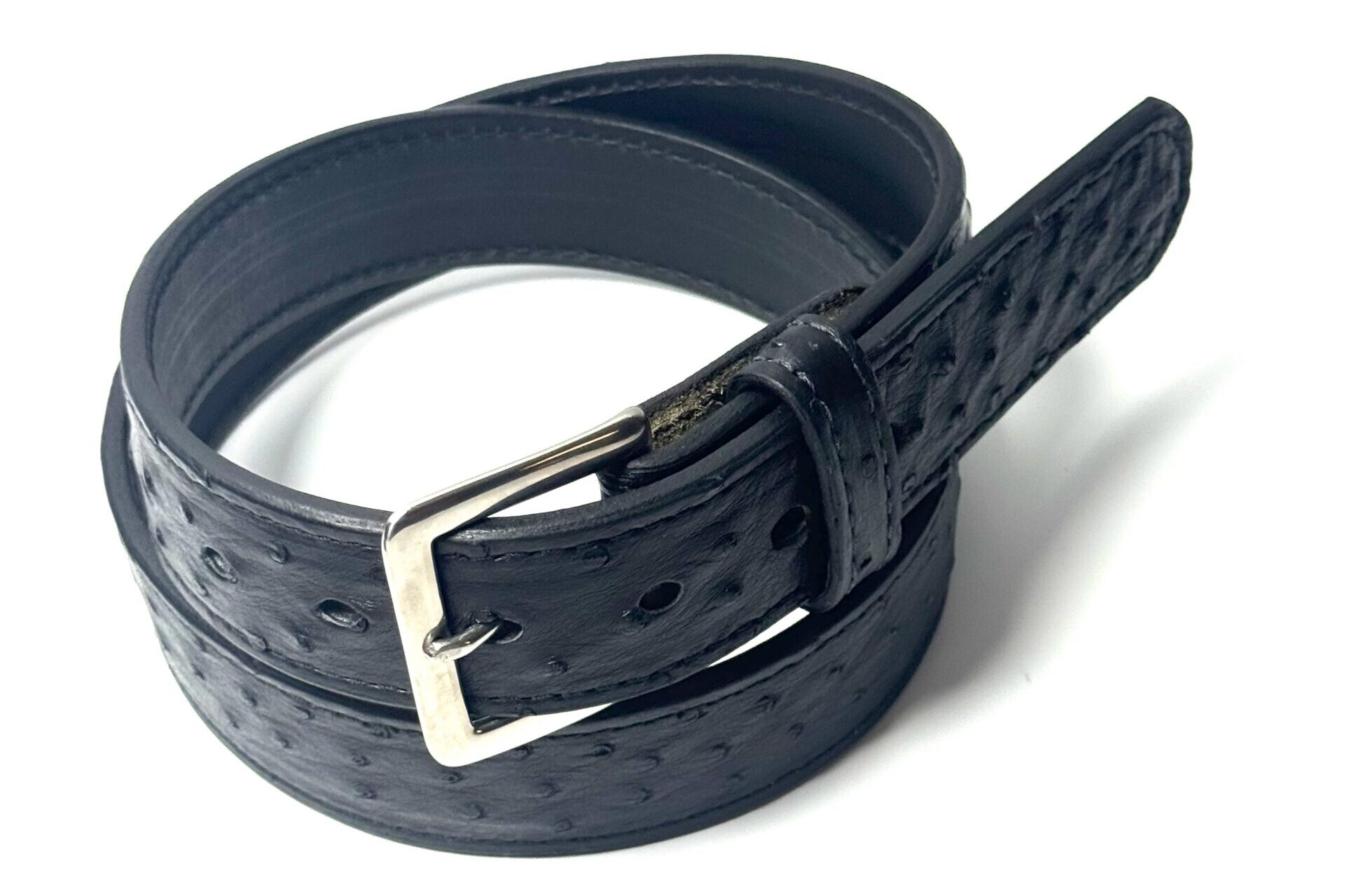 Close-up of natural quill texture on black ostrich leather belt