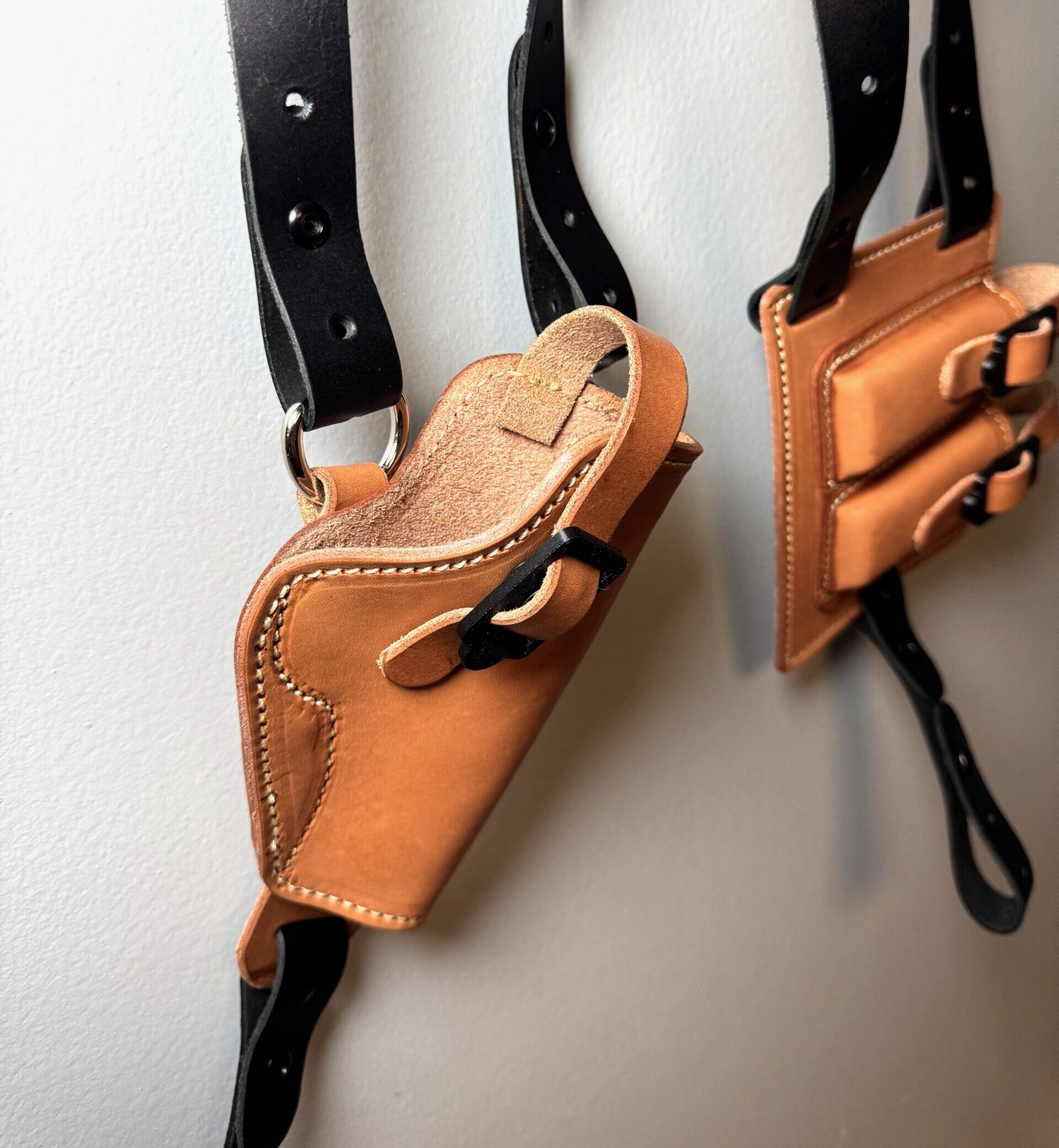 Reverse view of black and tan 1911 leather shoulder holster rig