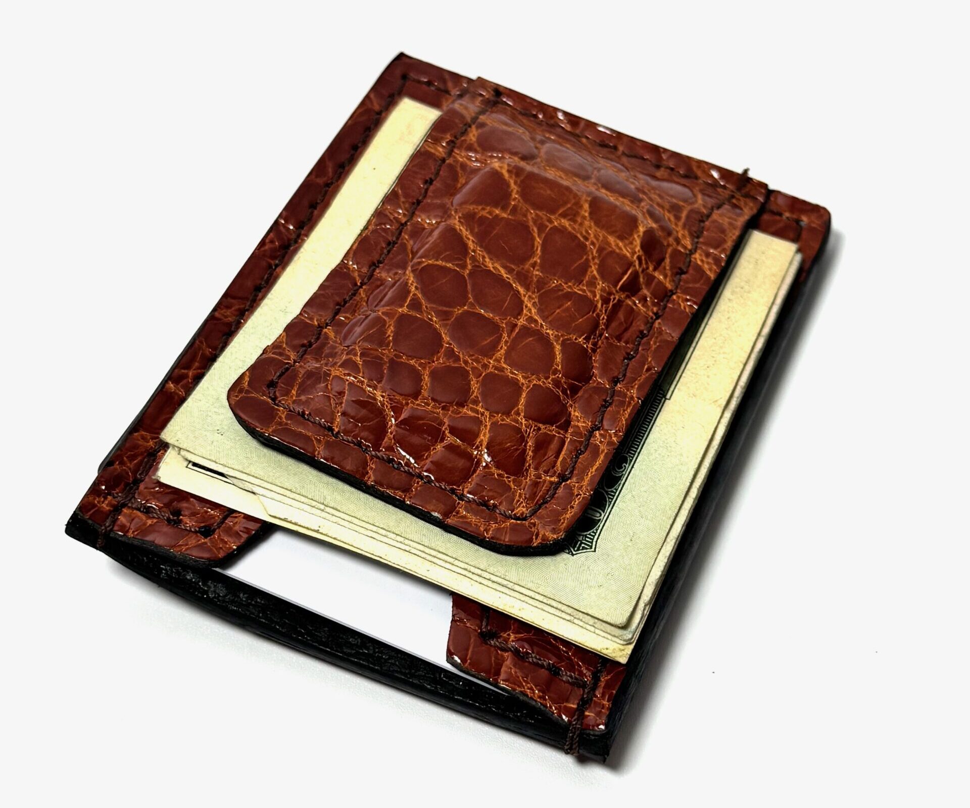 Open cognac alligator leather money clip wallet displaying the money clip, cash compartment, and card storage.