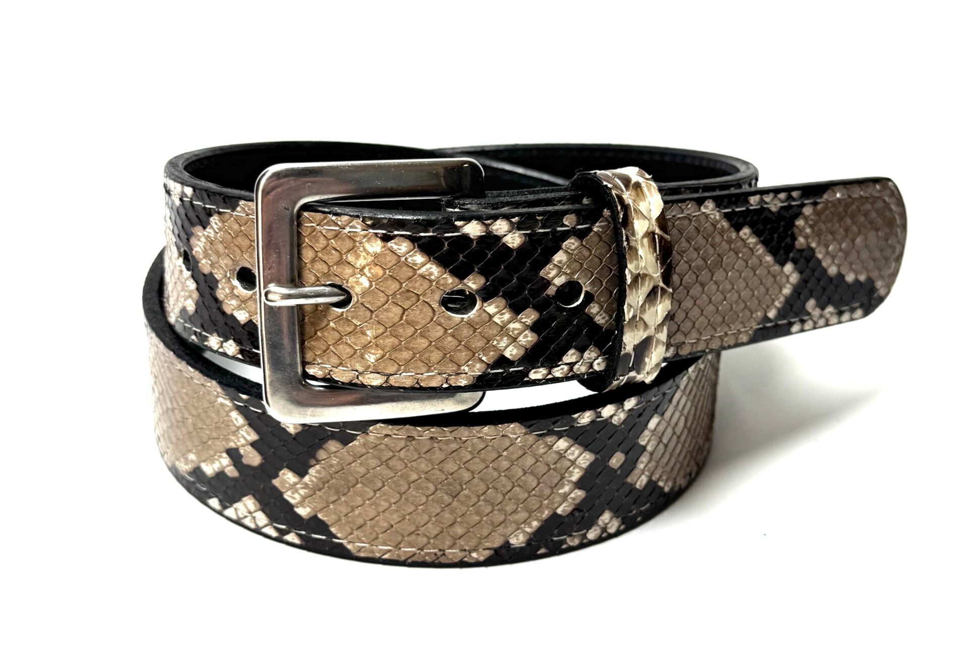 Rolled natural python leather belt showing black full-grain leather backing
