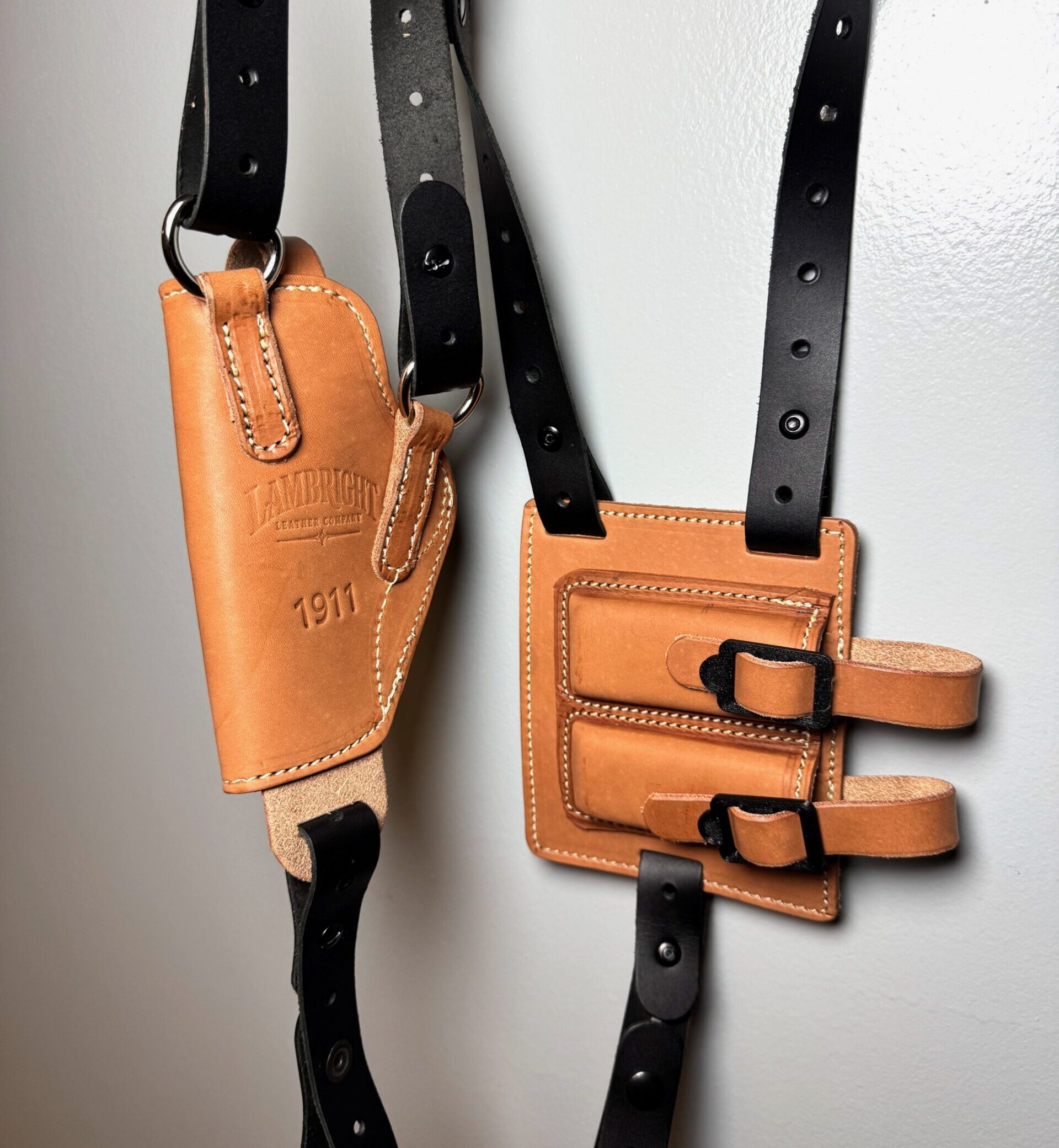 Tan leather 1911 shoulder holster showing Lambright branding and stitching