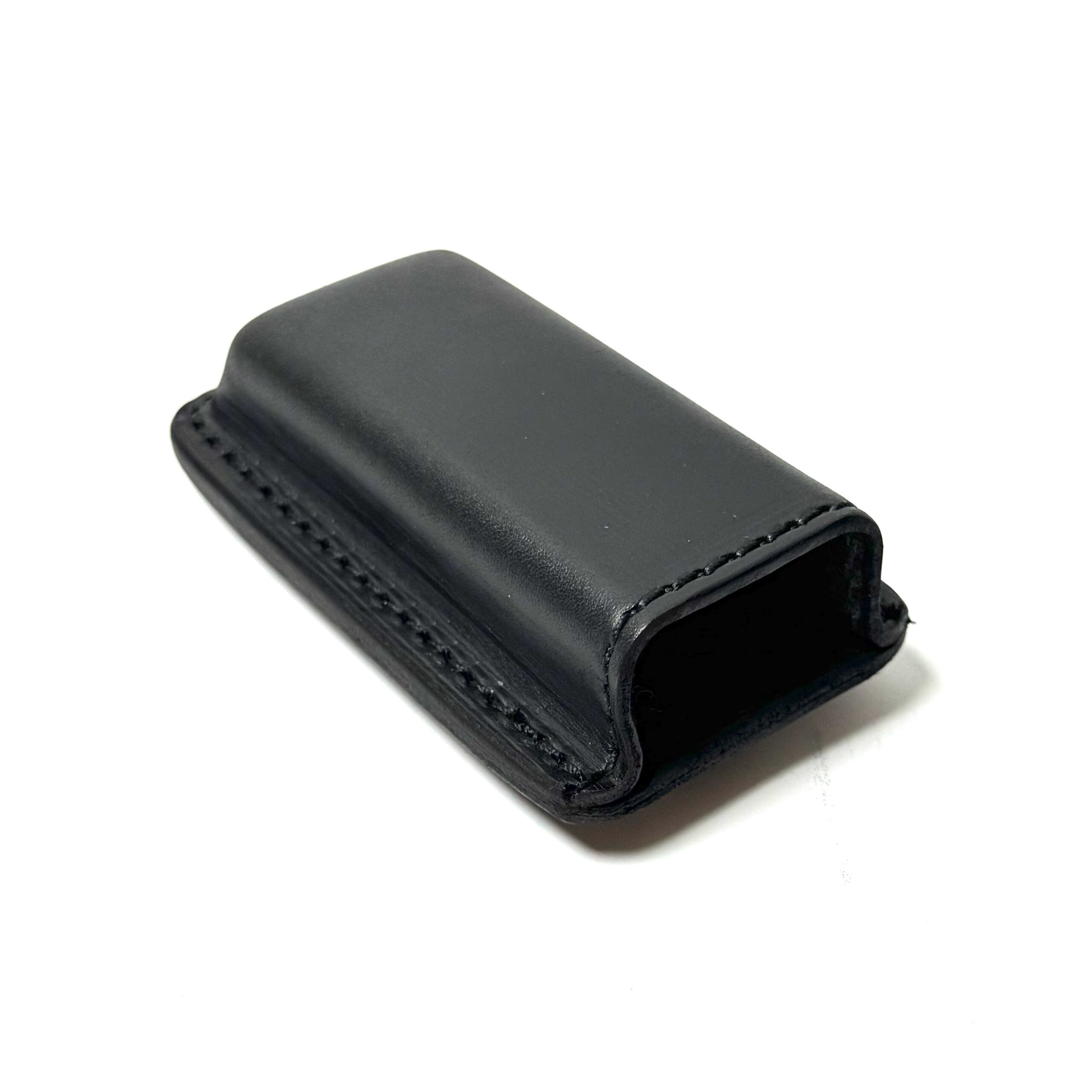 Black leather magazine carrier angled view showing leather construction
