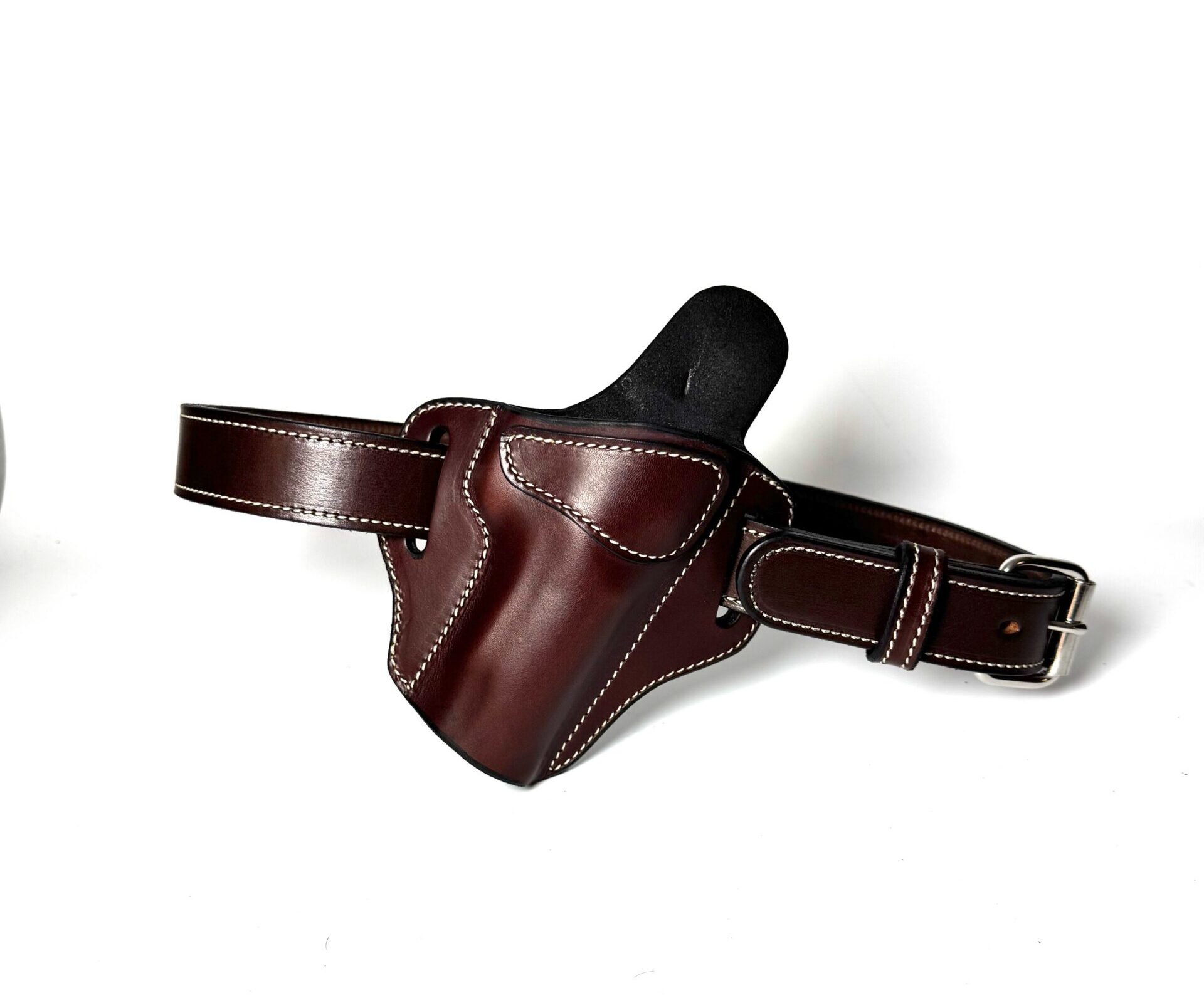 Brown heavy-duty leather gun belt laid out with 1911 holster