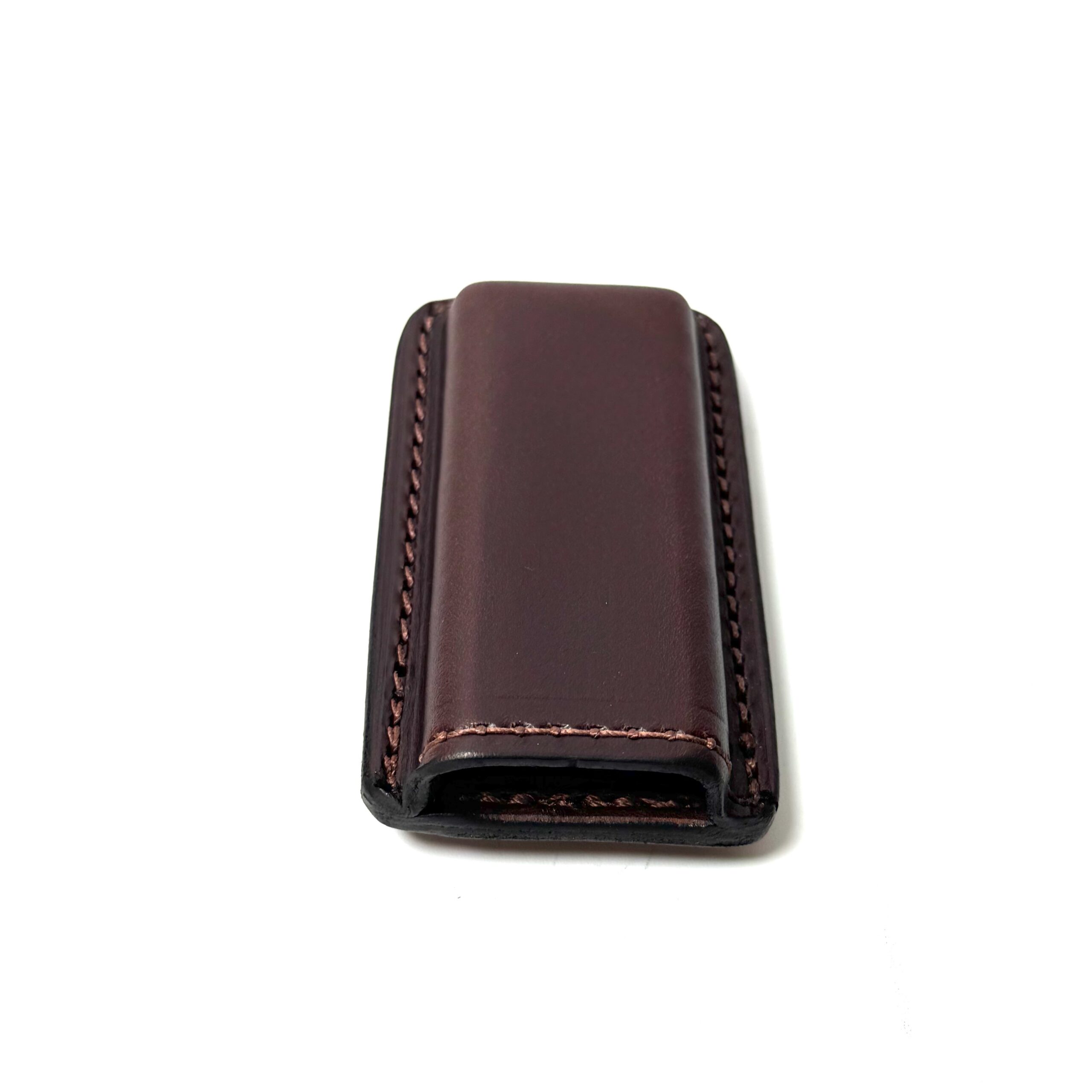 Brown leather magazine carrier with stitched cowhide construction